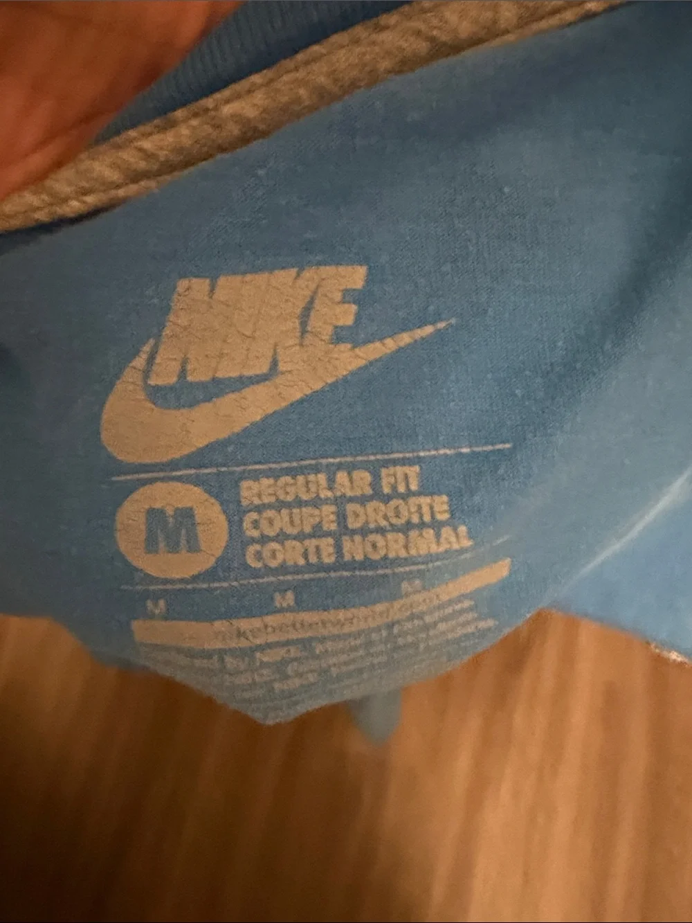 Nike Light Blue Tee with Striped White & Red Logo